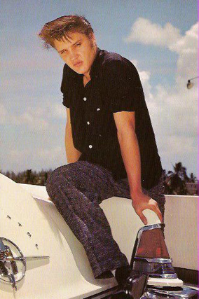 Elvis Presley on car fender 1956