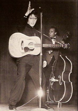 Elvis Presley on stage in 1956