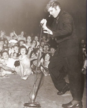 Elvis Presley on stage in 1956